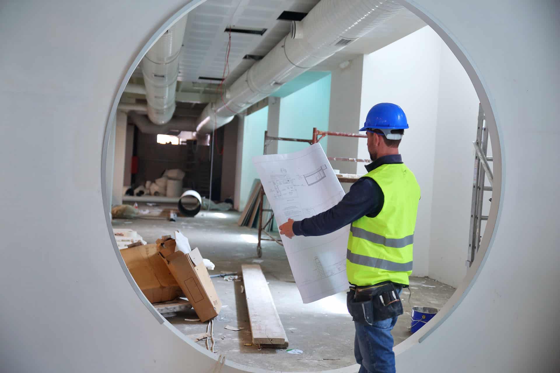 man holding blueprints